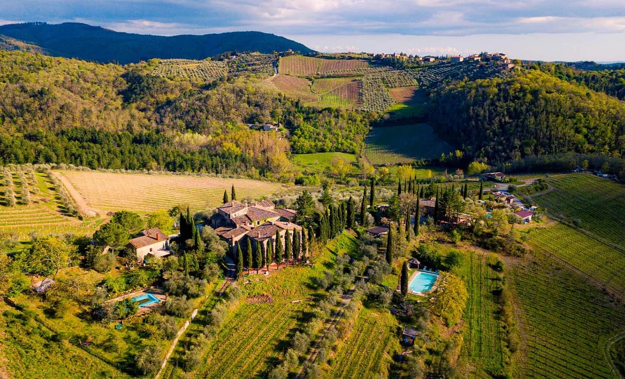 Aerial view of Borgo Casa al Vento estate among Chianti vineyards